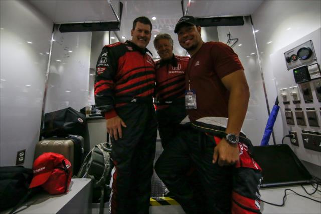Mario Andretti poses with Mark Schlereth of ESPN and NFL wide receiver Vincent Jackson before driving them in the two seater at the Firestone Grand Prix of St. Petersburg. -- Photo by: Joe Skibinski