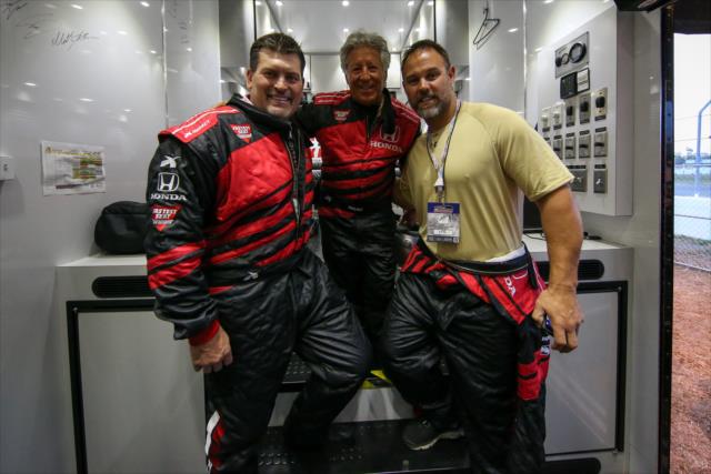 Mario Andretti poses with Mark Schlereth of ESPN and former Tampa Bay Buccaneer fullback Mike Alstott before driving them in the two seater at the Firestone Grand Prix of St. Petersburg. -- Photo by: Joe Skibinski
