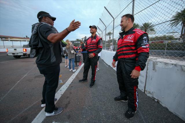 Ken Griffey Jr. talks with former Tampa Bay Buccaneer fullback Mike Alstott and NFL wide receiver Vincent Jackson before they take a ride in the two seater at the Firestone Grand Prix of St. Petersburg. -- Photo by: Joe Skibinski