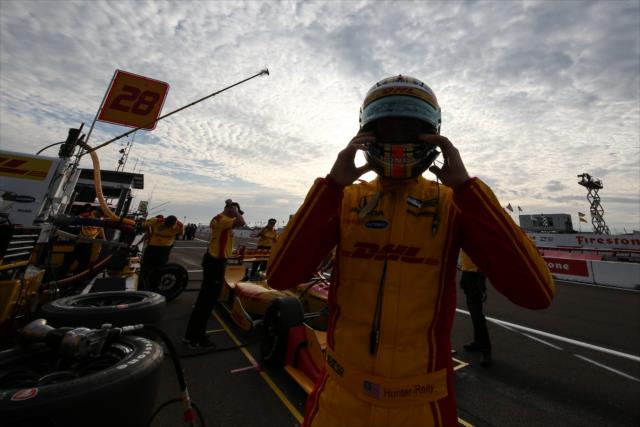 Ryan Hunter-Reay slides on his helmet prior to the start of the final warmup for the Firestone Grand Prix of St. Petersburg -- Photo by: Joe Skibinski
