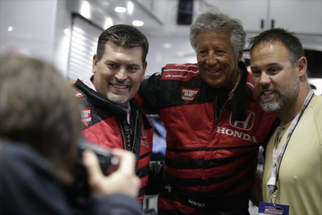Mario Andretti poses for a photograph with ESPN's Mark Schlereth and former NFL fullback Mike Alstott prior to their two-seater rides in St. Petersburg -- Photo by: Shawn Gritzmacher