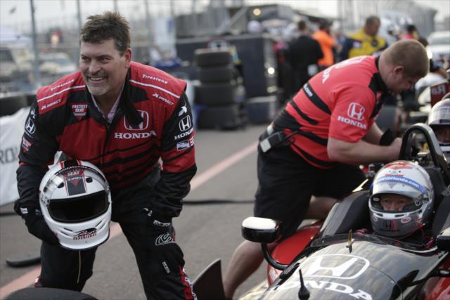 ESPN NFL Analyst Mark Schlereth poses with Mario Andretti in the two-seater following his ride around the streets of St. Petersburg -- Photo by: Shawn Gritzmacher