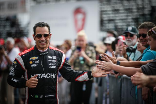Helio Castroneves greets the fans during pre-race festivities for the Firestone Grand Prix of St. Petersburg -- Photo by: Shawn Gritzmacher