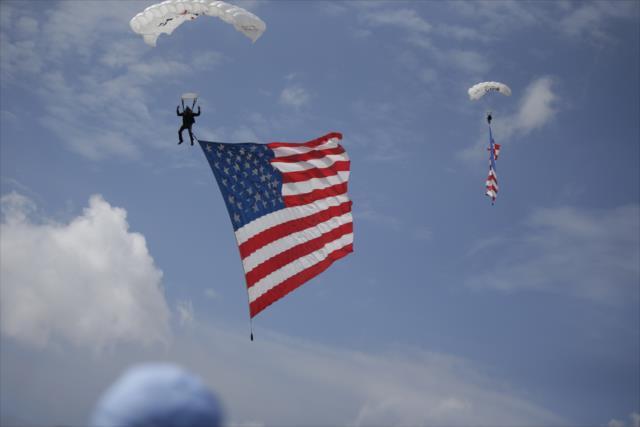 The American flags arrive from the sky during pre-race festivities for the Firestone Grand Prix of St. Petersburg -- Photo by: Shawn Gritzmacher