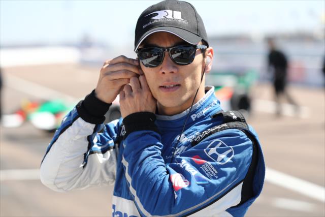 Takuma Sato sets his earpieces along pit lane prior to the start of practice for the Firestone Grand Prix of St. Petersburg -- Photo by: Chris Jones