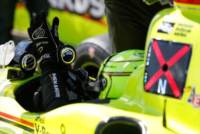 Simon Pagenaud adjusts his gloves along pit lane prior to practice for the Firestone Grand Prix of St. Petersburg -- Photo by: Joe Skibinski