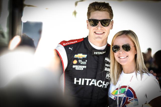 Josef Newgarden poses for a photograph during the autograph session in the INDYCAR Fan Village at St. Petersburg -- Photo by: Shawn Gritzmacher