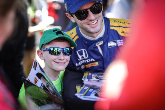 Alexander Rossi poses for a photograph during the autograph session in the INDYCAR Fan Village at St. Petersburg -- Photo by: Shawn Gritzmacher