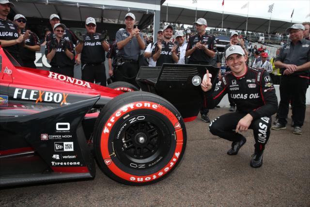 Robert Wickens affixes the Verizon P1 Award emblem on his car after winning the pole position for the Firestone Grand Prix of St. Petersburg -- Photo by: Chris Jones