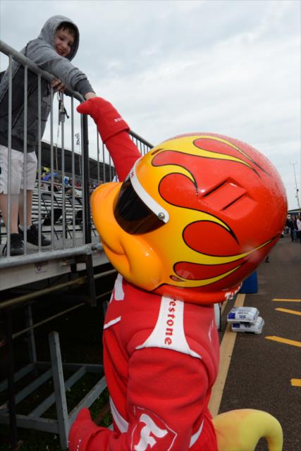 The Firestone Firehawk with a fist bump for a young fan along pit lane at St. Petersburg -- Photo by: James  Black