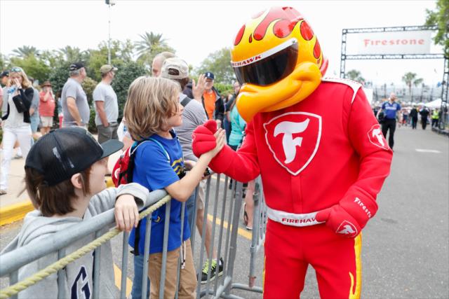 The Firestone Firehawk greets a few young fans near the paddock prior to qualifications for the Firestone Grand Prix of St. Petersburg -- Photo by: Joe Skibinski