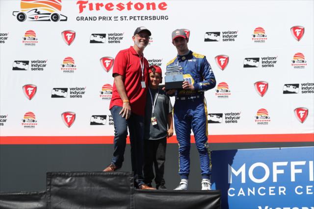 Alexander Rossi accepts his 3rd Place trophy in Victory Circle following the 2018 Firestone Grand Prix of St. Petersburg -- Photo by: Chris Jones