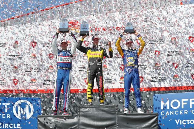 The confetti flies in Victory Circle for Sebastien Bourdais, Graham Rahal, and Alexander Rossi following the Firestone Grand Prix of St. Petersburg -- Photo by: Chris Jones