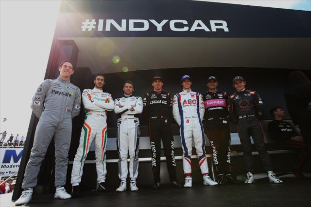 The seven rookies in the field pose for a photograph during pre-race festivities for the Firestone Grand Prix of St. Petersburg -- Photo by: Chris Jones