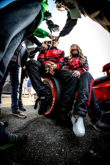 Arie Luyendyk Jr. and Lauren Burnham are interviewed by the media following their two-seater around the Streets of St. Petersburg -- Photo by: Shawn Gritzmacher