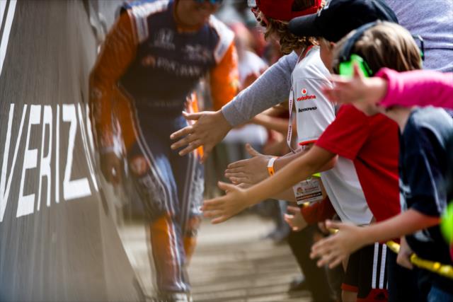 Scott Dixon gives high-fives to young fans during pre-race introductions for the Firestone Grand Prix of St. Petersburg -- Photo by: Shawn Gritzmacher
