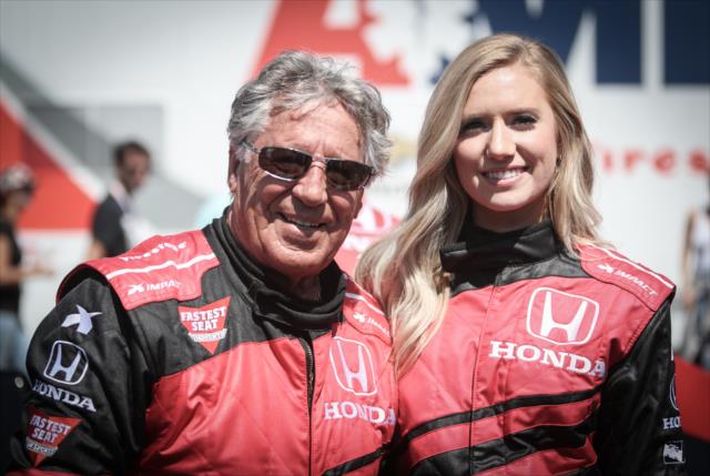 Mario Andretti and Lauren Burnham pose for a photo before their two-seater ride in St. Petersburg -- Photo by: Shawn Gritzmacher