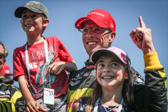 Sebastien Bourdais with his children in Victory Circle after winning the Firestone Grand Prix of St. Petersburg -- Photo by: Shawn Gritzmacher