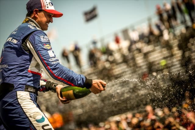 Graham Rahal sprays the champagne in Victory Circle following the Firestone Grand Prix of St. Petersburg -- Photo by: Shawn Gritzmacher