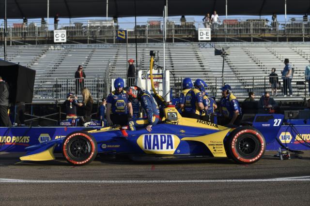 Alexander Rossi slides into his No. 27 NAPA Auto Parts Honda on pit lane prior to the final warmup for the Firestone Grand Prix of St. Petersburg -- Photo by: Chris Owens