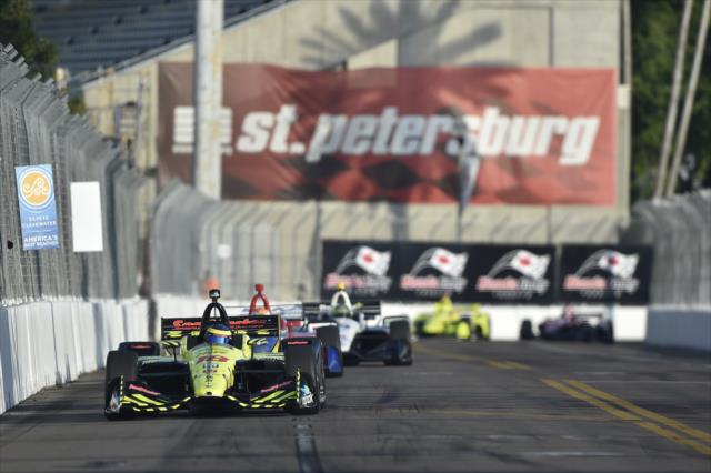 Sebastien Bourdais leads a train of cars toward Turn 10 during the final warmup for the Firestone Grand Prix of St. Petersburg -- Photo by: Chris Owens