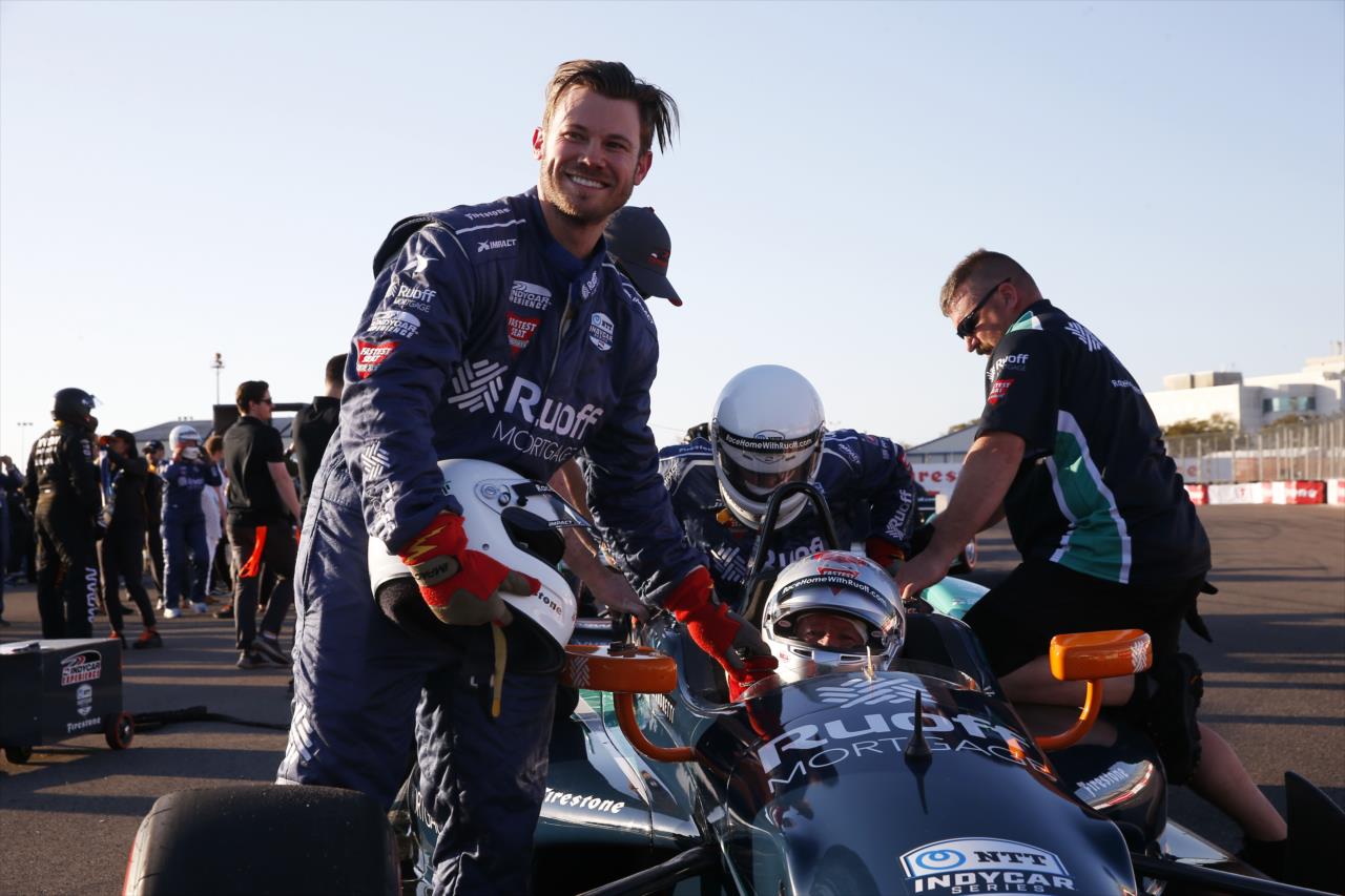 Olympic bronze medalist Joey Mantia poses with Mario Andretti after Ruoff 2-Seater ride - Firestone Grand Prix of St. Petersburg - By: Chris Jones -- Photo by: Chris Jones