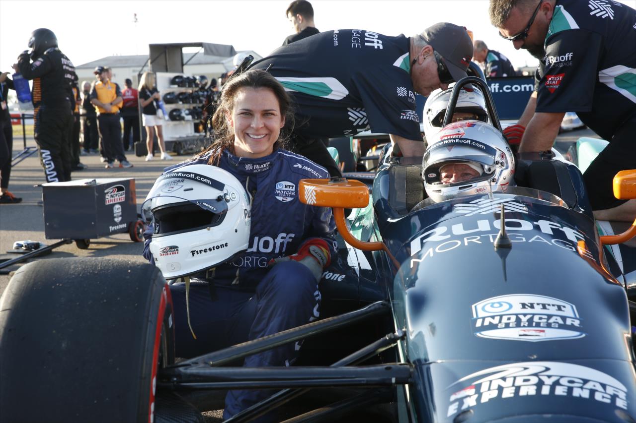 Olympic bronze medalist Brittany Bowe poses with Ruoff 2-Seater driver Mario Andretti  - Firestone Grand Prix of St. Petersburg - By: Chris Jones -- Photo by: Chris Jones