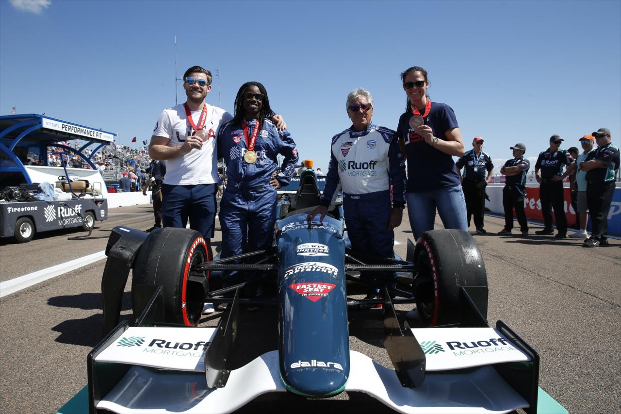 Olympic speed skaters Brittany Bowe, Erin Jackson and Joey Mantia with Mario Andretti - Firestone Grand Prix of St. Petersburg - By: Chris Jones -- Photo by: Chris Jones
