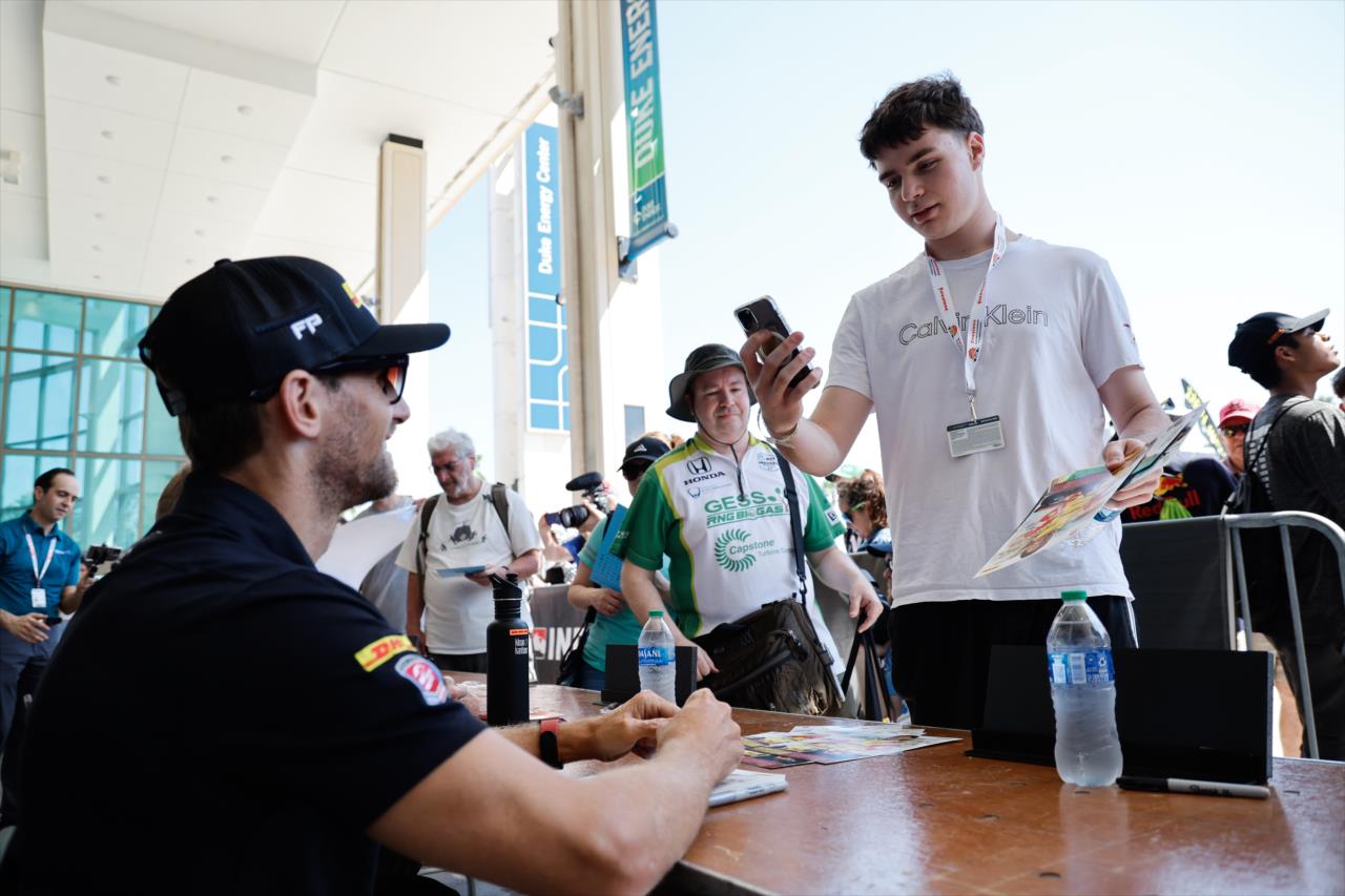 Romain Grosjean signs for fans - Firestone Grand Prix of St. Petersburg - By: Joe Skibinski -- Photo by: Joe Skibinski