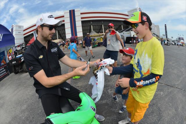 James Hinchcliffe signs an autograph for a young fan. -- Photo by: John Cote