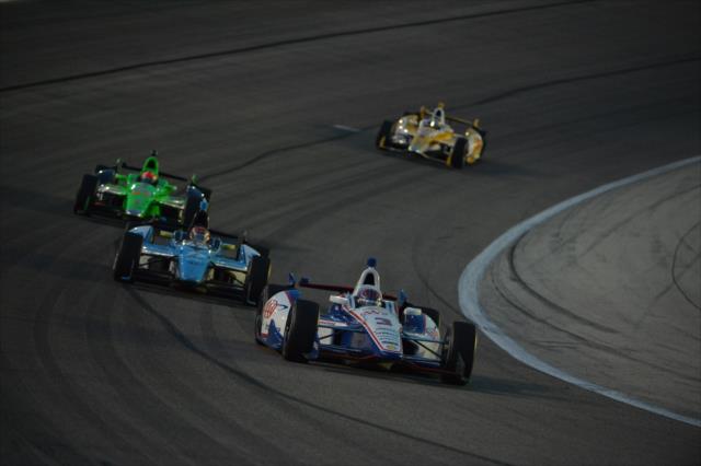 Helio Castroneves leads Simon Pagenaud, James Hinchcliffe, and Ryan Hunter-Reay into Turn 1 -- Photo by: John Cote