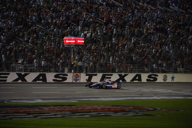 Helio Castroneves takes the checkered flags at Texas Motor Speedway -- Photo by: John Cote