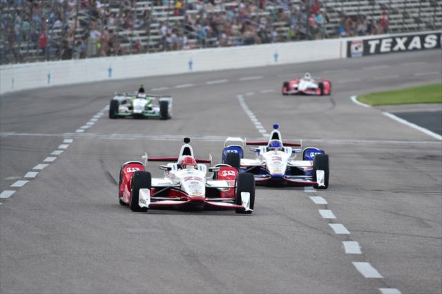 Simon Pagenaud and Helio Castroneves go nose-to-tail setting up for Turn 1 during the Firestone 600 at Texas Motor Speedway -- Photo by: Chris Owens