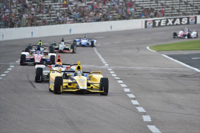 Marco Andretti leads a group into Turn 1 during the Firestone 600 at Texas Motor Speedway -- Photo by: Chris Owens