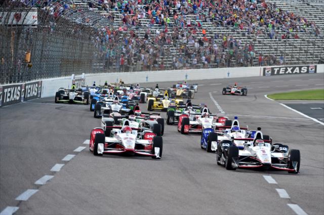 Will Power and Simon Pagenaud lead the field into Turn 1 during the start of the Firestone 600 at Texas Motor Speedway -- Photo by: Chris Owens
