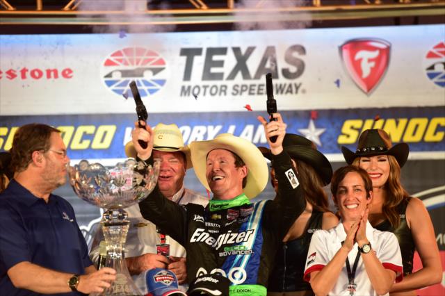 Scott Dixon fires off the six-shooters following his win in the Firestone 600 at Texas Motor Speedway -- Photo by: Chris Owens