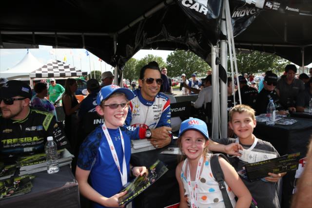 Helio Castroneves poses for a photograph during the autograph session at Texas Motor Speedway -- Photo by: Chris Jones