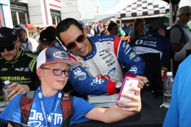 Helio Castroneves poses for a photograph during the autograph session at Texas Motor Speedway -- Photo by: Chris Jones
