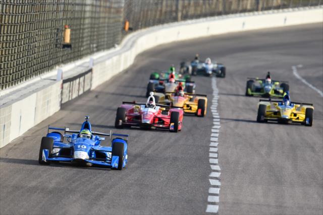 Tony Kanaan leads a group down the backstretch during the evening practice for the Firestone 600 at Texas Motor Speedway -- Photo by: Chris Owens