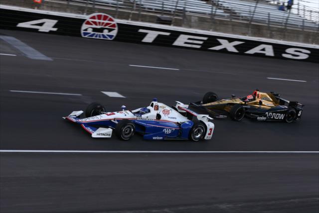 Helio Castroneves and James Hinchcliffe sail into Turn 4 during the Rainguard Water Sealers 600 at Texas Motor Speedway -- Photo by: Chris Jones