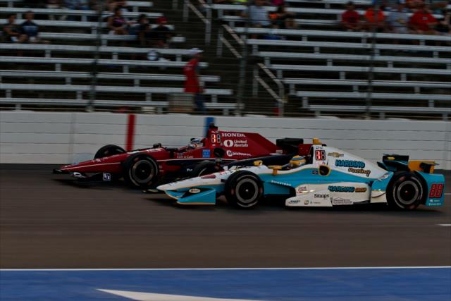 Graham Rahal and Gabby Chaves go wheel-to-wheel down the frontstretch during the Rainguard Water Sealers 600 at Texas Motor Speedway -- Photo by: Chris Jones