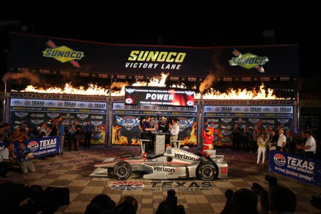 Will Power fires off the six-shooters in Victory Circle after winning the Rainguard Water Sealers 600 at Texas Motor Speedway -- Photo by: Chris Jones