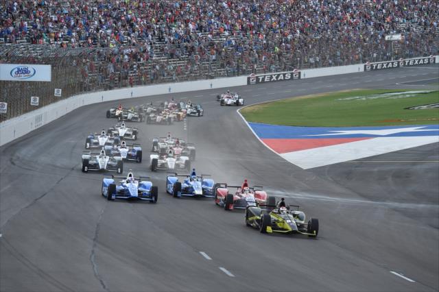 Charlie Kimball leads the field into Turn 1 to start the Rainguard Water Sealers 600 at Texas Motor Speedway -- Photo by: Chris Owens
