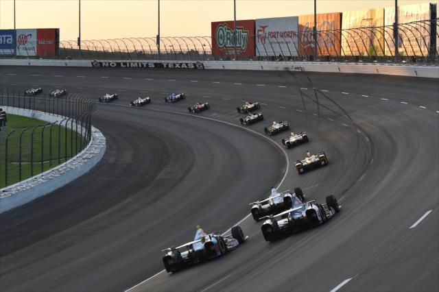 The field sails through Turns 3 and 4 during the Rainguard Water Sealers 600 at Texas Motor Speedway -- Photo by: Chris Owens