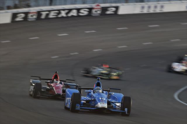 Tony Kanaan leads Mikhail Aleshin through Turn 2 during the Rainguard Water Sealers 600 at Texas Motor Speedway -- Photo by: Chris Owens