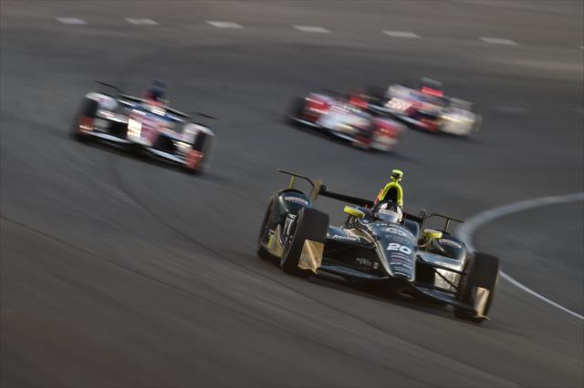 Ed Carpenter leads a group through Turn 2 during the Rainguard Water Sealers 600 at Texas Motor Speedway -- Photo by: Chris Owens