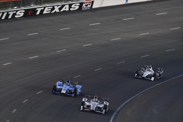 Will Power, Tony Kanaan, and Simon Pagenaud roll through Turn 2 during the Rainguard Water Sealers 600 at Texas Motor Speedway -- Photo by: Chris Owens