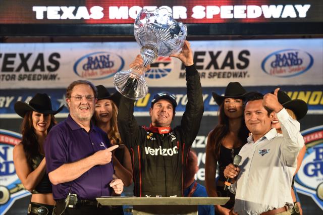 Will Power hoists the winner's trophy in Victory Circle after winning the Rainguard Water Sealers 600 at Texas Motor Speedway -- Photo by: Chris Owens
