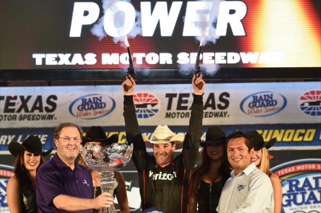 Will Power fires off the six-shooters in Victory Circle after winning the Rainguard Water Sealers 600 at Texas Motor Speedway -- Photo by: Chris Owens