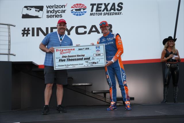 Scott Dixon accepts the Firestone Pit Stop Performance award on behalf of Chip Ganassi Racing for their performance in Detroit -- Photo by: Chris Jones
